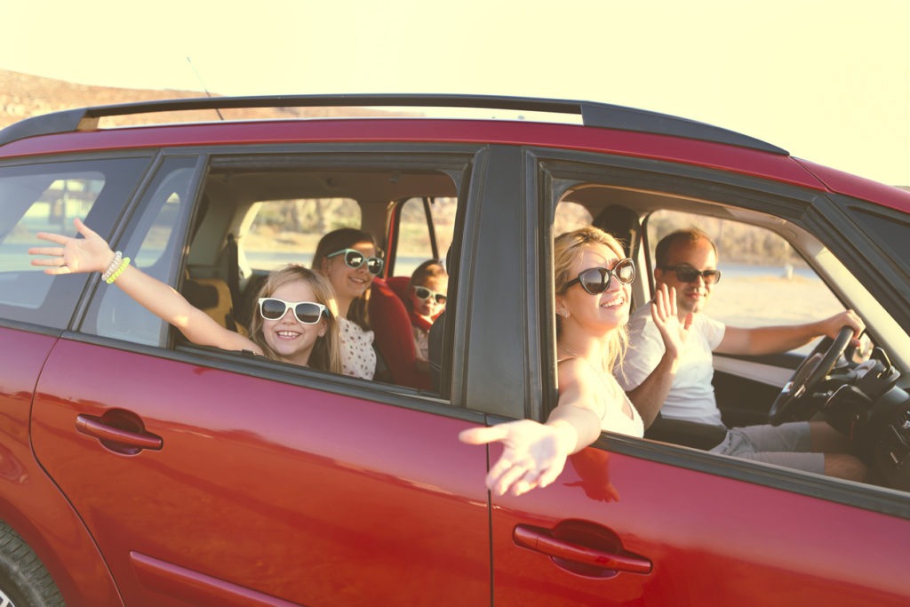 Happy Family in Their Newly Leased Car From Apple Leasing in Austin