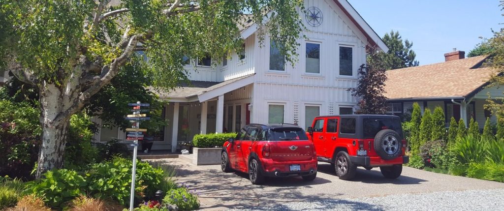 Red cars parked in driveway