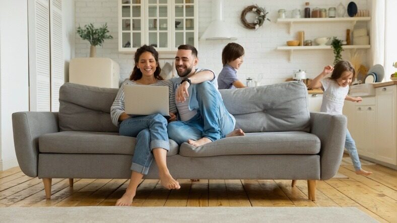 Family looking up cars on laptop